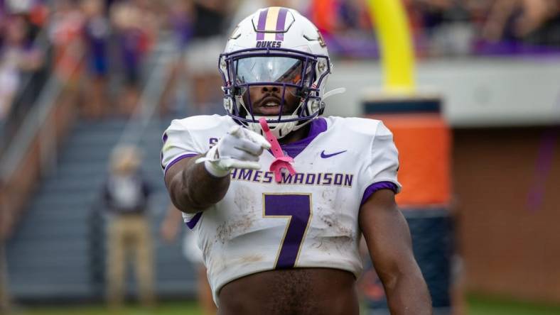 Sept 9, 2023; Charlottesville, Virginia, USA; James Madison Dukes running back Ty Son Lawton (7) points at the camera after scoring a touchdown against the Virginia Cavaliers during the second half at Scott Stadium. Mandatory Credit: Hannah Pajewski-USA TODAY Sports