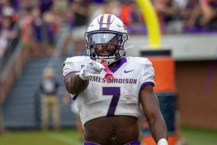Sept 9, 2023; Charlottesville, Virginia, USA; James Madison Dukes running back Ty Son Lawton (7) points at the camera after scoring a touchdown against the Virginia Cavaliers during the second half at Scott Stadium. Mandatory Credit: Hannah Pajewski-USA TODAY Sports