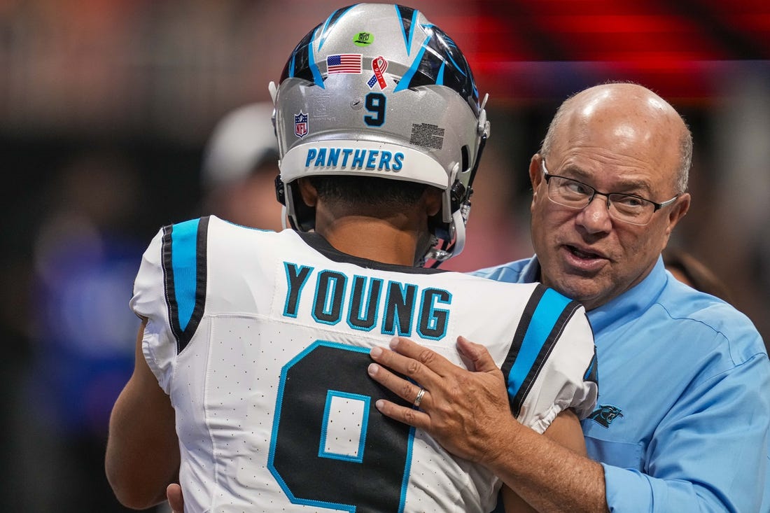Sep 10, 2023; Atlanta, Georgia, USA; Carolina Panthers quarterback Bryce Young (9) hugs team owner David Tepper on the field prior to the game against the Atlanta Falcons at Mercedes-Benz Stadium. Mandatory Credit: Dale Zanine-USA TODAY Sports