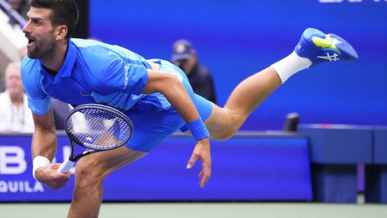 Sep 10, 2023; Flushing, NY, USA; Novak Djokovic of Serbia serves against Daniil Medvedev (not pictured) in the men's singles final on day fourteen of the 2023 U.S. Open tennis tournament at USTA Billie Jean King National Tennis Center. Mandatory Credit: Robert Deutsch-USA TODAY Sports