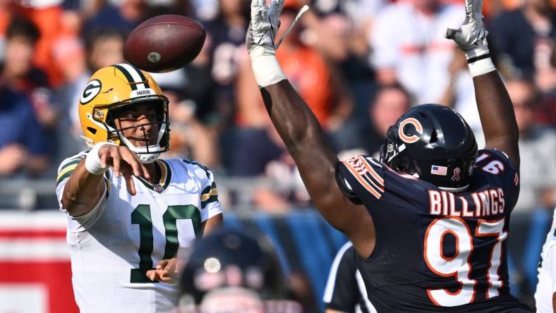 Sep 10, 2023; Chicago, Illinois, USA;  Green Bay Packers quarterback Jordan Love (10) passes over the defense of Chicago Bears defensive lineman Andrew Billings (97) in the first half at Soldier Field. Mandatory Credit: Jamie Sabau-USA TODAY Sports