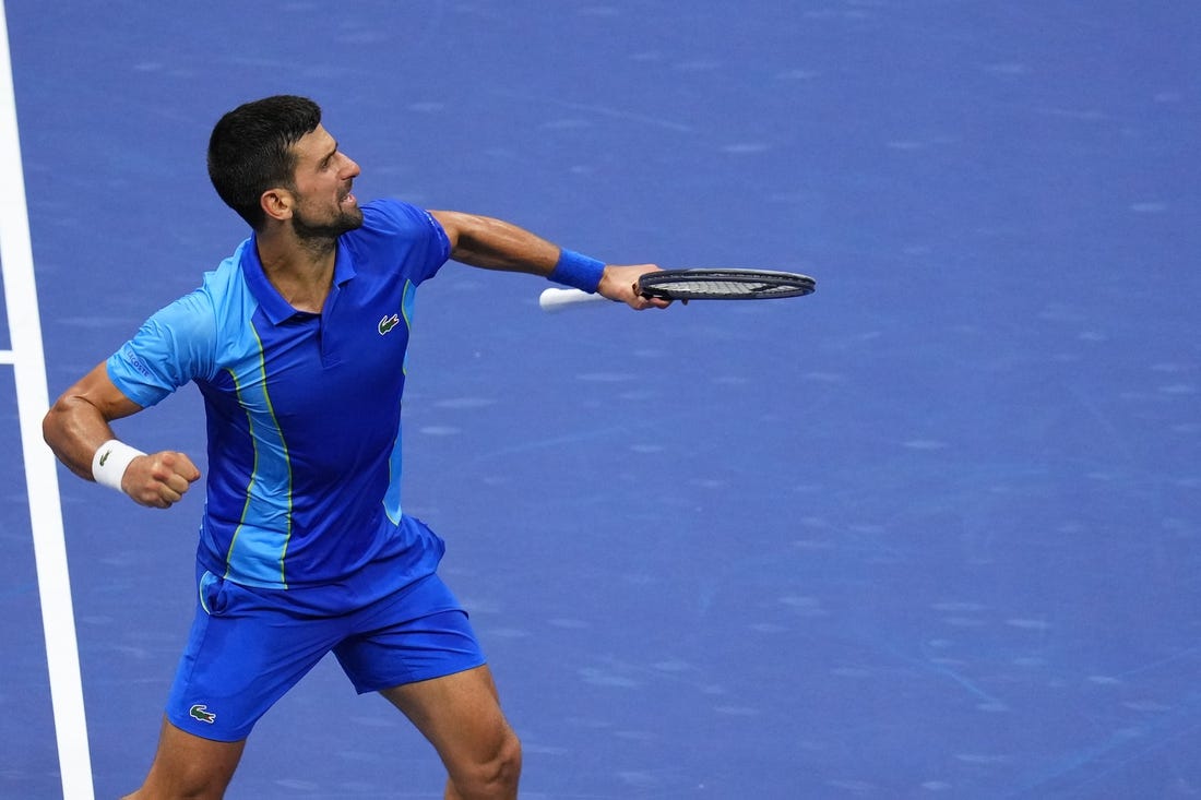 Sep 10, 2023; Flushing, NY, USA; Novak Djokovic of Serbia reacts after winning a point against Daniil Medvedev (not pictured) in the men's singles final in the men's singles final on day fourteen of the 2023 U.S. Open tennis tournament at USTA Billie Jean King National Tennis Center. Mandatory Credit: Danielle Parhizkaran-USA TODAY Sports