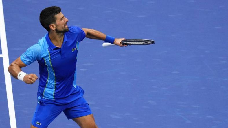 Sep 10, 2023; Flushing, NY, USA; Novak Djokovic of Serbia reacts after winning a point against Daniil Medvedev (not pictured) in the men's singles final in the men's singles final on day fourteen of the 2023 U.S. Open tennis tournament at USTA Billie Jean King National Tennis Center. Mandatory Credit: Danielle Parhizkaran-USA TODAY Sports