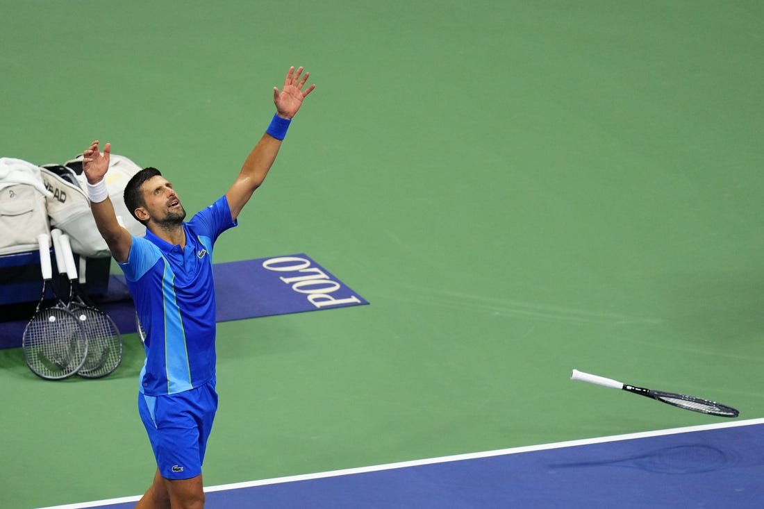 Sep 10, 2023; Flushing, NY, USA; Novak Djokovic of Serbia celebrates after his match against Daniil Medvedev (not pictured) in the men's singles final in the men's singles final in the men's singles final on day fourteen of the 2023 U.S. Open tennis tournament at USTA Billie Jean King National Tennis Center. Mandatory Credit: Danielle Parhizkaran-USA TODAY Sports