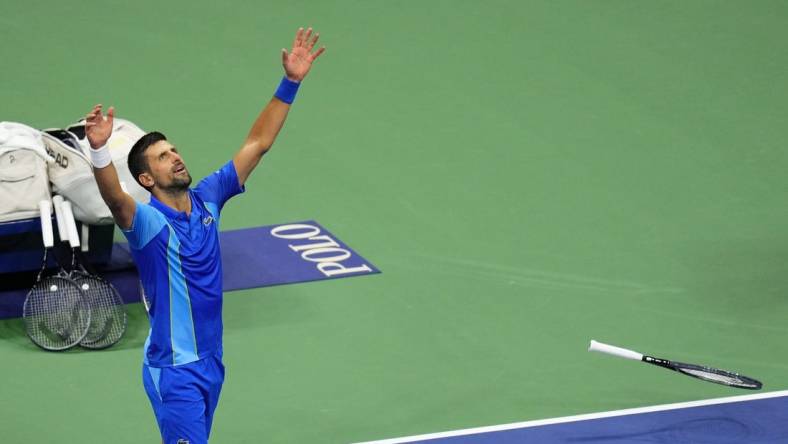 Sep 10, 2023; Flushing, NY, USA; Novak Djokovic of Serbia celebrates after his match against Daniil Medvedev (not pictured) in the men's singles final in the men's singles final in the men's singles final on day fourteen of the 2023 U.S. Open tennis tournament at USTA Billie Jean King National Tennis Center. Mandatory Credit: Danielle Parhizkaran-USA TODAY Sports