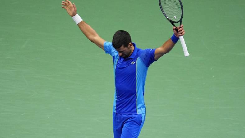 Sep 10, 2023; Flushing, NY, USA; Novak Djokovic of Serbia reacts after winning a point against Daniil Medvedev (not pictured) in the men's singles final in the men's singles final on day fourteen of the 2023 U.S. Open tennis tournament at USTA Billie Jean King National Tennis Center. Mandatory Credit: Danielle Parhizkaran-USA TODAY Sports