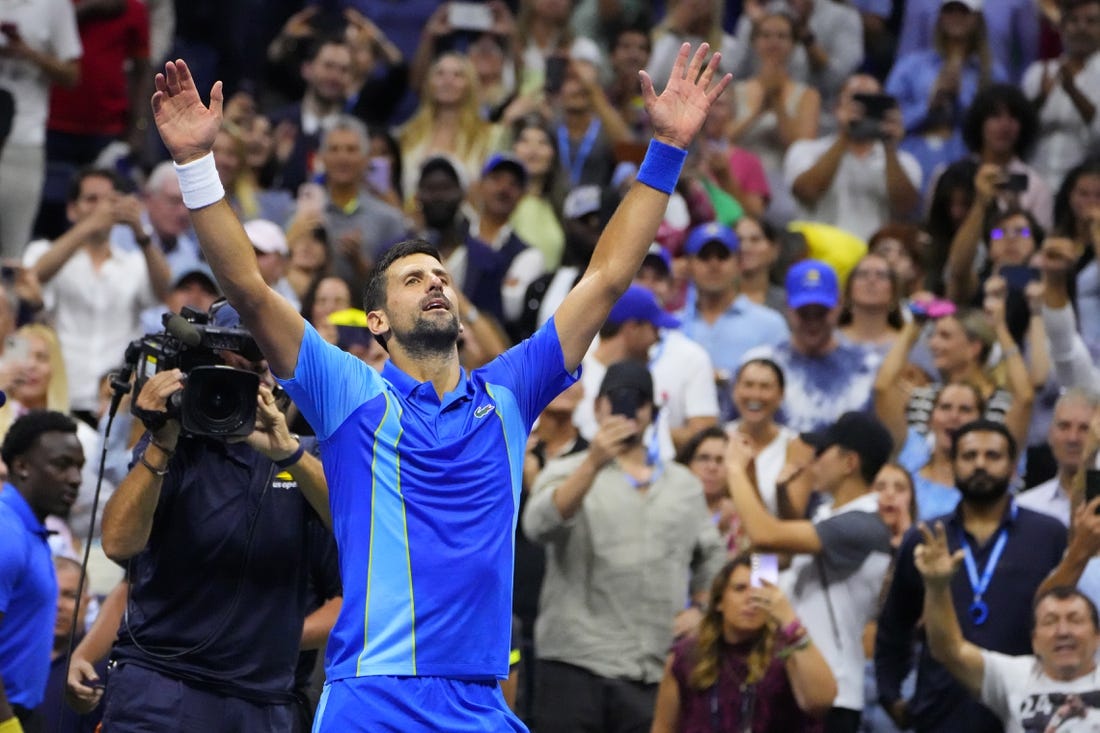 Sep 10, 2023; Flushing, NY, USA; Novak Djokovic of Serbia celebrates after match point against Daniil Medvedev (not pictured) in the men's singles final on day fourteen of the 2023 U.S. Open tennis tournament at USTA Billie Jean King National Tennis Center. Mandatory Credit: Robert Deutsch-USA TODAY Sports