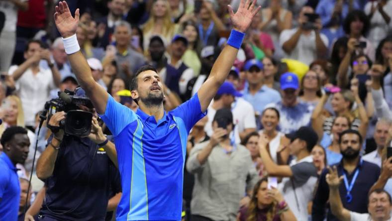 Sep 10, 2023; Flushing, NY, USA; Novak Djokovic of Serbia celebrates after match point against Daniil Medvedev (not pictured) in the men's singles final on day fourteen of the 2023 U.S. Open tennis tournament at USTA Billie Jean King National Tennis Center. Mandatory Credit: Robert Deutsch-USA TODAY Sports