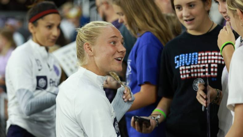 Sep 15, 2023; Louisville, Kentucky, USA; Racing Louisville FC midfielder Maddie Pokorny (17) speaks with fans following the match against the Houston Dash at Lynn Family Stadium. Mandatory Credit: EM Dash-USA TODAY Sports