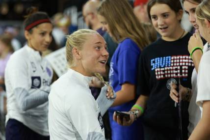 Sep 15, 2023; Louisville, Kentucky, USA; Racing Louisville FC midfielder Maddie Pokorny (17) speaks with fans following the match against the Houston Dash at Lynn Family Stadium. Mandatory Credit: EM Dash-USA TODAY Sports