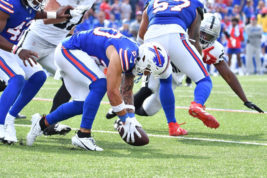 Sep 17, 2023; Orchard Park, New York, USA; Buffalo Bills safety Taylor Rapp (20) picks up a fumble by the Las Vegas Raiders in the fourth quarter at Highmark Stadium. Mandatory Credit: Mark Konezny-USA TODAY Sports