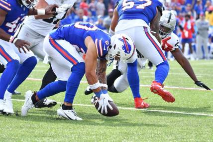 Sep 17, 2023; Orchard Park, New York, USA; Buffalo Bills safety Taylor Rapp (20) picks up a fumble by the Las Vegas Raiders in the fourth quarter at Highmark Stadium. Mandatory Credit: Mark Konezny-USA TODAY Sports