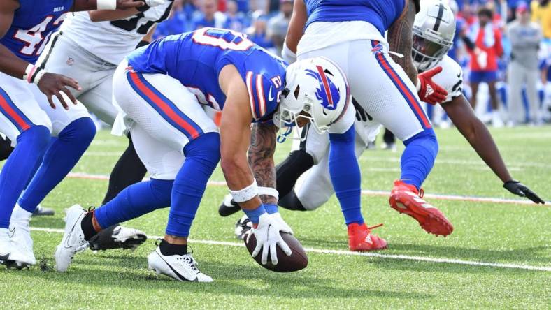 Sep 17, 2023; Orchard Park, New York, USA; Buffalo Bills safety Taylor Rapp (20) picks up a fumble by the Las Vegas Raiders in the fourth quarter at Highmark Stadium. Mandatory Credit: Mark Konezny-USA TODAY Sports