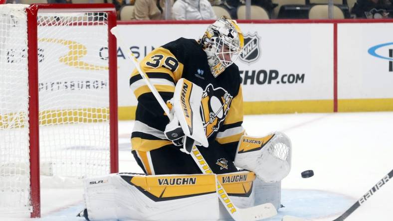Sep 24, 2023; Pittsburgh, Pennsylvania, USA;  Pittsburgh Penguins goalie Alex Nedeljkovic (39) makes a save against the Columbus Blue Jackets during the first period at PPG Paints Arena. Mandatory Credit: Charles LeClaire-USA TODAY Sports