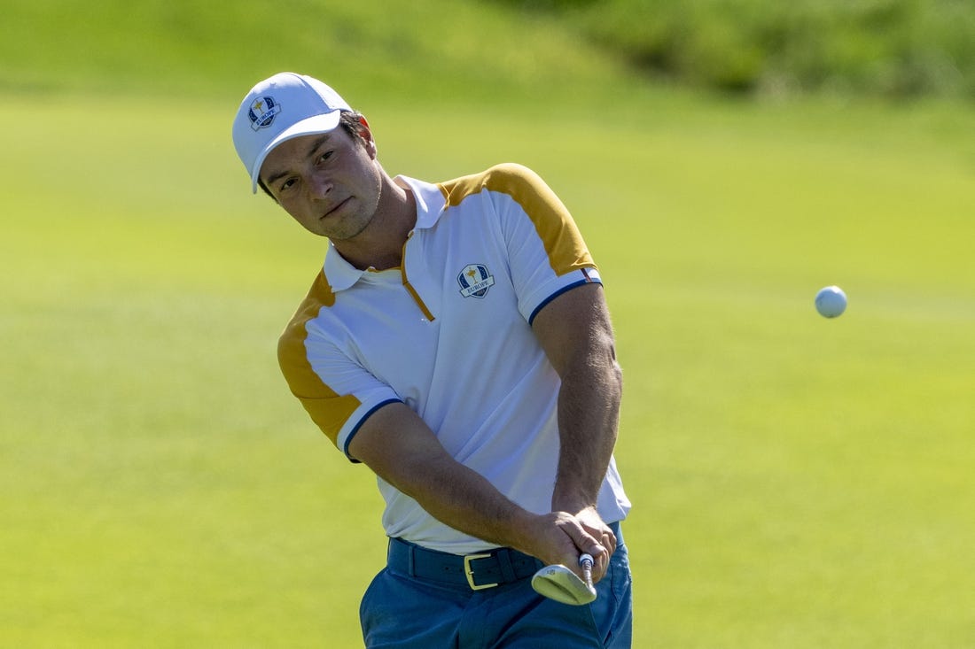 September 26, 2023; Rome, ITALY; Team Europe golfer Viktor Hovland hits his chip shot on the second hole during a practice round of the Ryder Cup golf competition at Marco Simone Golf and Country Club. Mandatory Credit: Kyle Terada-USA TODAY Sports