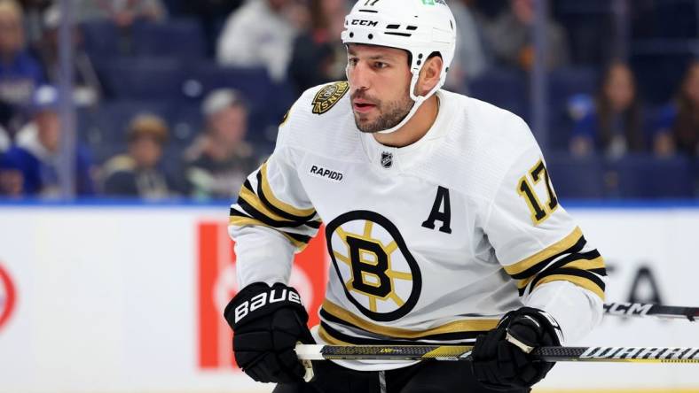 Sep 26, 2023; Buffalo, New York, USA;  Boston Bruins left wing Milan Lucic (17) looks for the puck during the first period against the Buffalo Sabres at KeyBank Center. Mandatory Credit: Timothy T. Ludwig-USA TODAY Sports