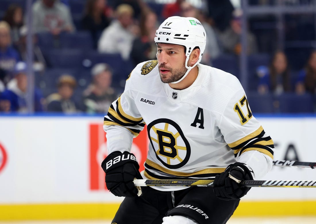 Sep 26, 2023; Buffalo, New York, USA;  Boston Bruins left wing Milan Lucic (17) looks for the puck during the first period against the Buffalo Sabres at KeyBank Center. Mandatory Credit: Timothy T. Ludwig-USA TODAY Sports