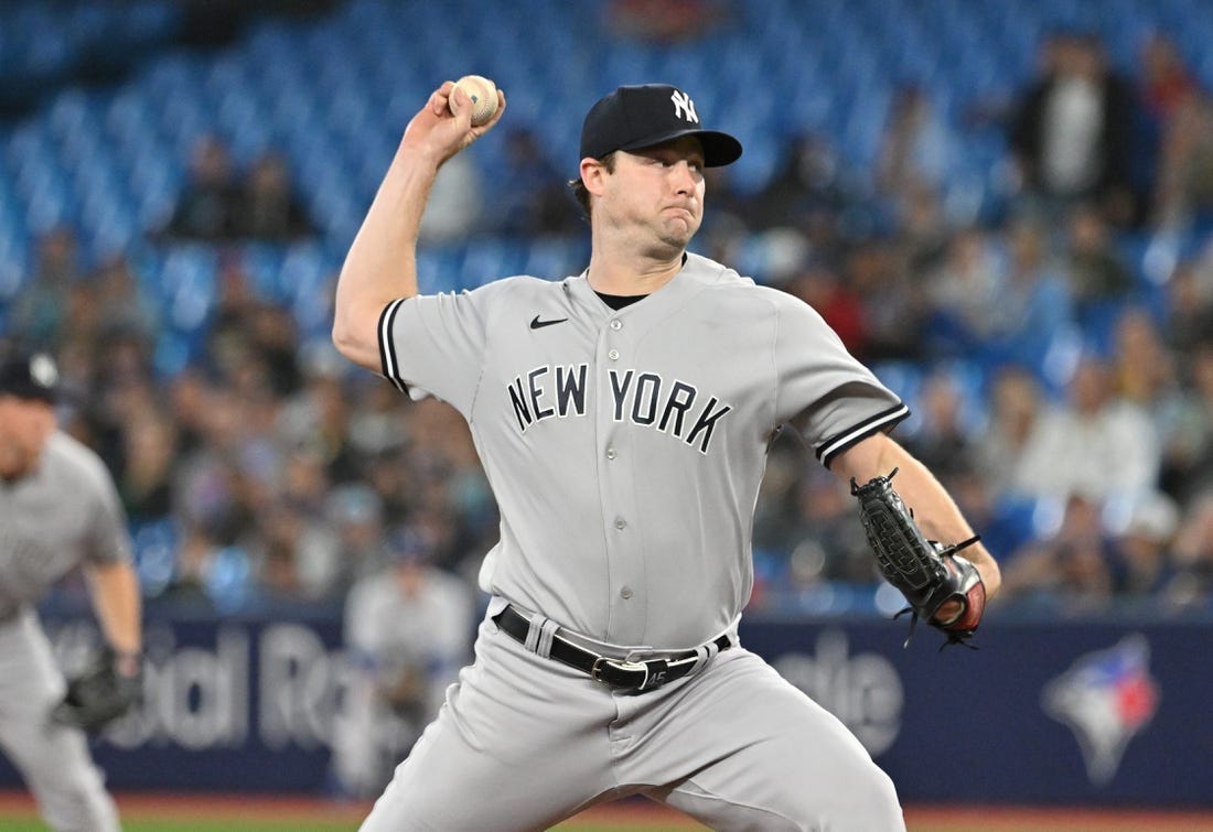 Sep 27, 2023; Toronto, Ontario, CAN; New York Yankee starting pitcher Gerrit Cole (45) delivers a pitch against the Toronto Blue Jays in the first inning at Rogers Centre. Mandatory Credit: Dan Hamilton-USA TODAY Sports