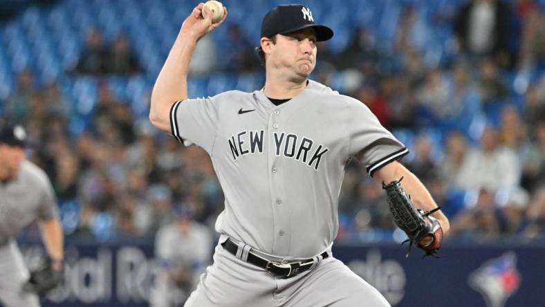 Sep 27, 2023; Toronto, Ontario, CAN; New York Yankee starting pitcher Gerrit Cole (45) delivers a pitch against the Toronto Blue Jays in the first inning at Rogers Centre. Mandatory Credit: Dan Hamilton-USA TODAY Sports