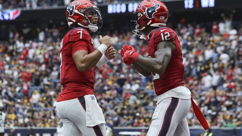 Oct 1, 2023; Houston, Texas, USA; Houston Texans quarterback C.J. Stroud (7) celebrates with wide receiver Nico Collins (12) after a touchdown during the game against the Pittsburgh Steelers at NRG Stadium. Mandatory Credit: Troy Taormina-USA TODAY Sports