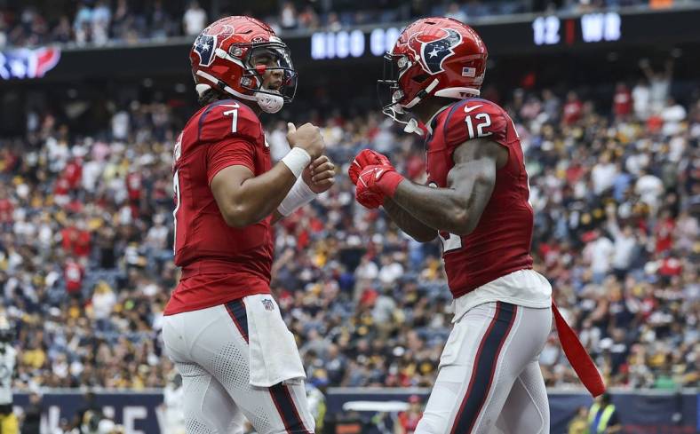 Oct 1, 2023; Houston, Texas, USA; Houston Texans quarterback C.J. Stroud (7) celebrates with wide receiver Nico Collins (12) after a touchdown during the game against the Pittsburgh Steelers at NRG Stadium. Mandatory Credit: Troy Taormina-USA TODAY Sports