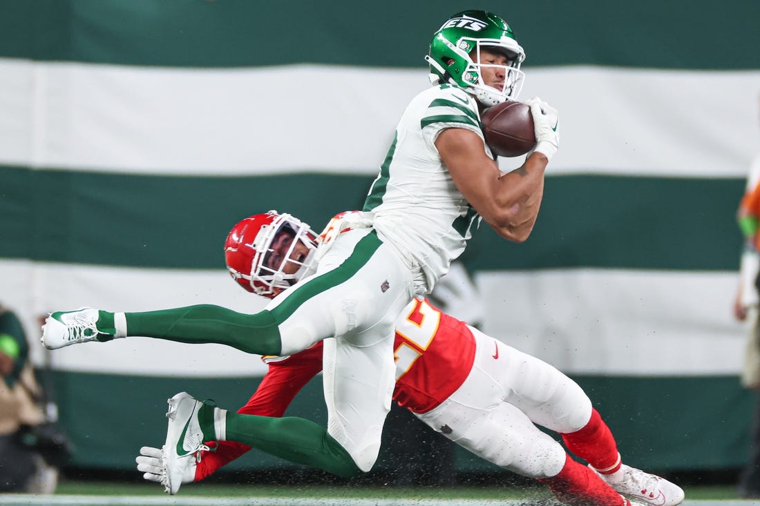 Oct 1, 2023; East Rutherford, New Jersey, USA; New York Jets wide receiver Allen Lazard (10) makes a catch as Kansas City Chiefs cornerback Trent McDuffie (22) defends during the first half at MetLife Stadium. Mandatory Credit: Vincent Carchietta-USA TODAY Sports