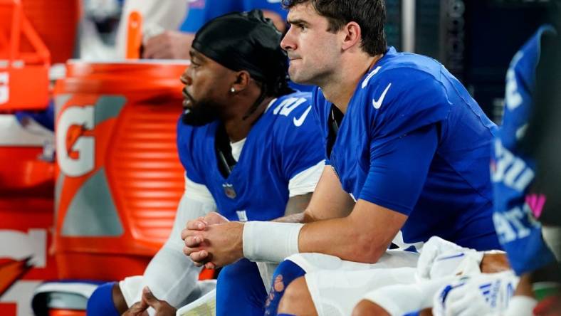 New York Giants quarterback Daniel Jones, right, sits with quarterback Tyrod Taylor (2) in the second half. The Seahawks defeat the Giants, 24-3, at MetLife Stadium on Monday, Oct. 2, 2023, in East Rutherford.