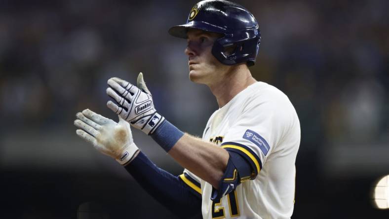 Oct 4, 2023; Milwaukee, Wisconsin, USA; Milwaukee Brewers player Mark Canha (21) reacts after hitting a single in the eighth inning against the Arizona Diamondbacks during game two of the Wildcard series for the 2023 MLB playoffs at American Family Field. Mandatory Credit: Kamil Krzaczynski-USA TODAY Sports