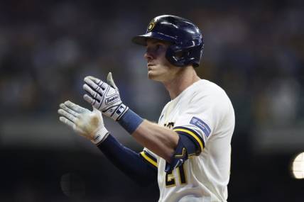 Oct 4, 2023; Milwaukee, Wisconsin, USA; Milwaukee Brewers player Mark Canha (21) reacts after hitting a single in the eighth inning against the Arizona Diamondbacks during game two of the Wildcard series for the 2023 MLB playoffs at American Family Field. Mandatory Credit: Kamil Krzaczynski-USA TODAY Sports