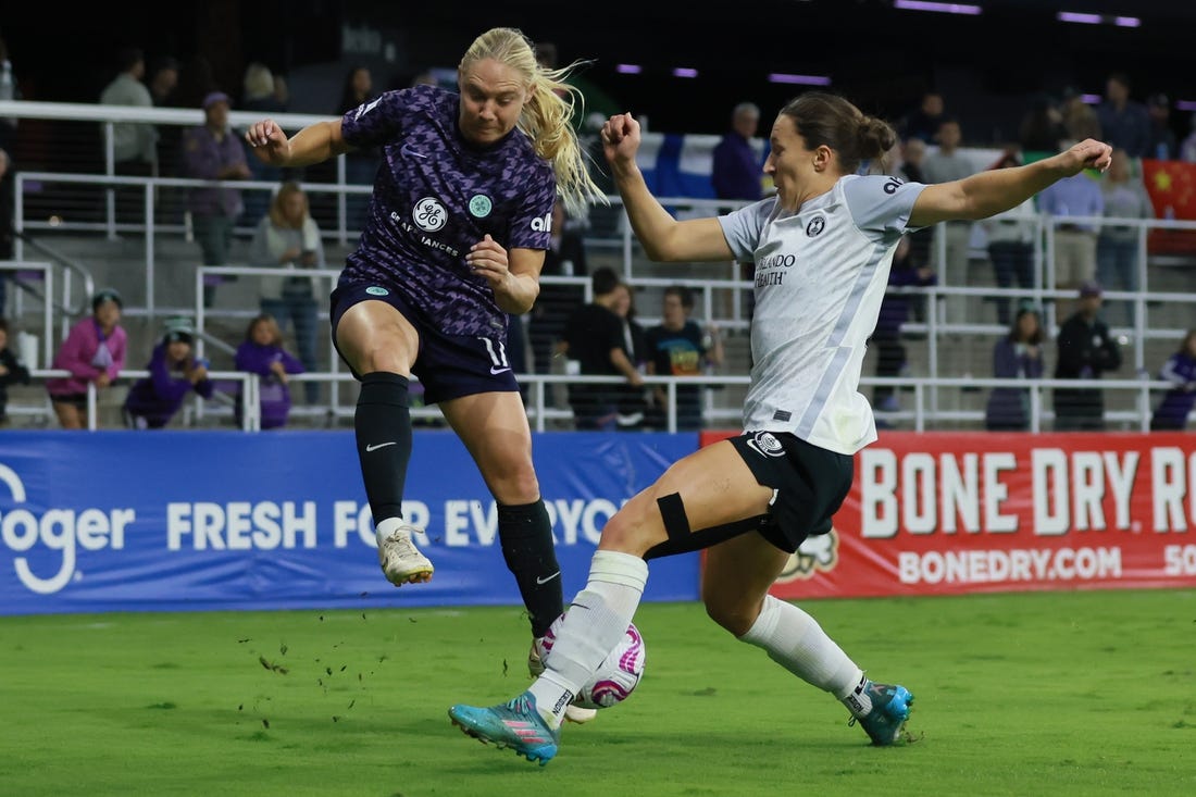 Oct 6, 2023; Louisville, Kentucky, USA; Racing Louisville FC midfielder Maddie Pokorny (17) and Orlando Pride forward Messiah Bright (23) battle for the ball in the second half at Lynn Family Stadium. Mandatory Credit: EM Dash-USA TODAY Sports