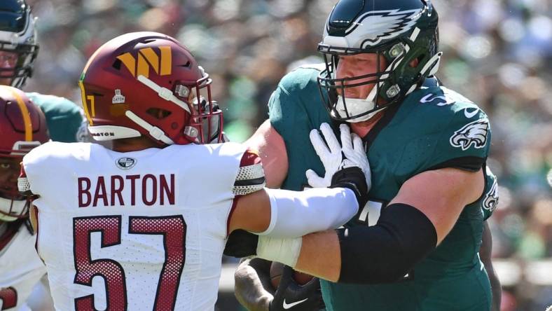 Oct 1, 2023; Philadelphia, Pennsylvania, USA; Philadelphia Eagles center Cam Jurgens (51) blocks Washington Commanders linebacker Cody Barton (57) at Lincoln Financial Field. Mandatory Credit: Eric Hartline-USA TODAY Sports