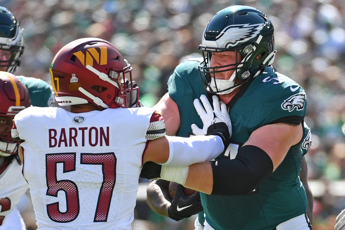 Oct 1, 2023; Philadelphia, Pennsylvania, USA; Philadelphia Eagles center Cam Jurgens (51) blocks Washington Commanders linebacker Cody Barton (57) at Lincoln Financial Field. Mandatory Credit: Eric Hartline-USA TODAY Sports