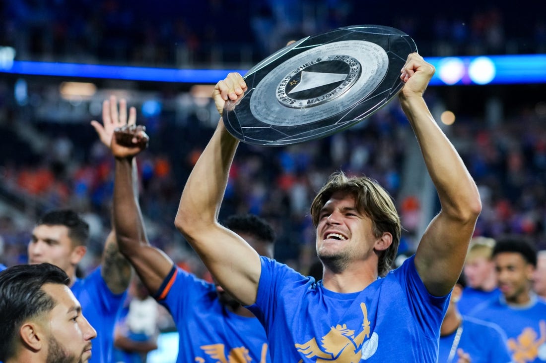 Oct 4, 2023; Cincinnati, Ohio, USA;  FC Cincinnati defender Nick Hagglund celebrates with the Supporters    Shield at TQL Stadium. Mandatory Credit: Aaron Doster-USA TODAY Sports