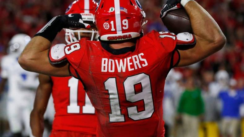 Georgia tight end Brock Bowers (19) celebrates after scoring a touchdown against Kentucky in Athens, Ga., on Saturday, Oct. 7, 2023.