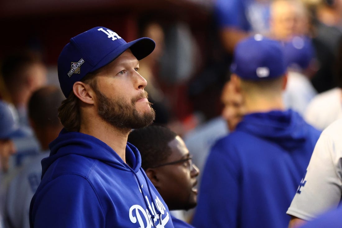 Oct 11, 2023; Phoenix, Arizona, USA; Los Angeles Dodgers starting pitcher Clayton Kershaw (22) in the dug out before during three of the NLDS for the 2023 MLB playoffs against the Arizona Diamondbacks at Chase Field. Mandatory Credit: Mark J. Rebilas-USA TODAY Sports