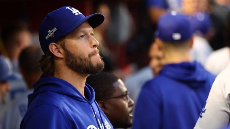 Oct 11, 2023; Phoenix, Arizona, USA; Los Angeles Dodgers starting pitcher Clayton Kershaw (22) in the dug out before during three of the NLDS for the 2023 MLB playoffs against the Arizona Diamondbacks at Chase Field. Mandatory Credit: Mark J. Rebilas-USA TODAY Sports