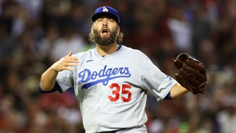 Oct 11, 2023; Phoenix, Arizona, USA; Los Angeles Dodgers starting pitcher Lance Lynn (35) reacts against the Arizona Diamondbacks in the second inning for game three of the NLDS for the 2023 MLB playoffs at Chase Field. Mandatory Credit: Mark J. Rebilas-USA TODAY Sports