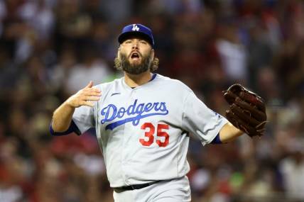 Oct 11, 2023; Phoenix, Arizona, USA; Los Angeles Dodgers starting pitcher Lance Lynn (35) reacts against the Arizona Diamondbacks in the second inning for game three of the NLDS for the 2023 MLB playoffs at Chase Field. Mandatory Credit: Mark J. Rebilas-USA TODAY Sports