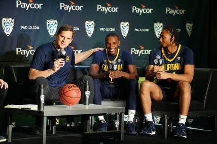 Oct 11, 2023; Las Vegas, NV, USA; California Golden Bears coach Mark Madsen (left), guard Keonte Kennedy (3) and forward Grant Newell (14) during Pac-12 Media Day at Park MGM Las Vegas Conference Center. Mandatory Credit: Kirby Lee-USA TODAY Sports