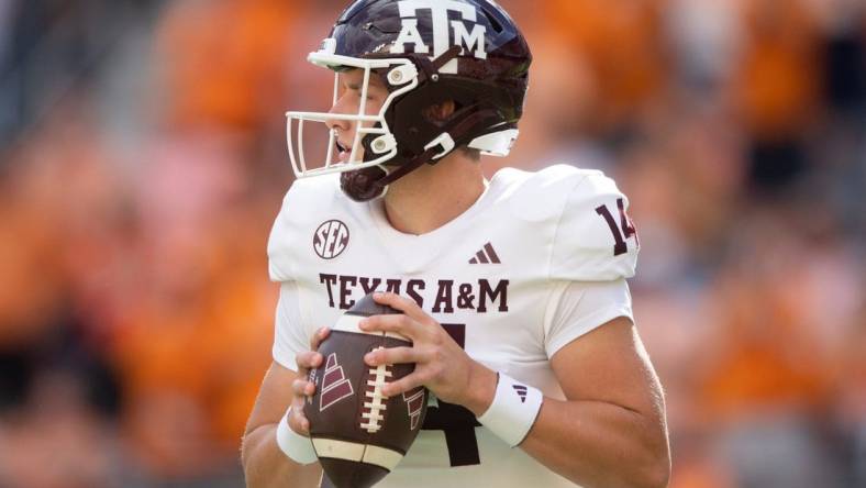 Texas A&M quarterback Max Johnson (14) looks to pass during a football game between Tennessee and Texas A&M at Neyland Stadium in Knoxville, Tenn., on Saturday, Oct. 14, 2023.