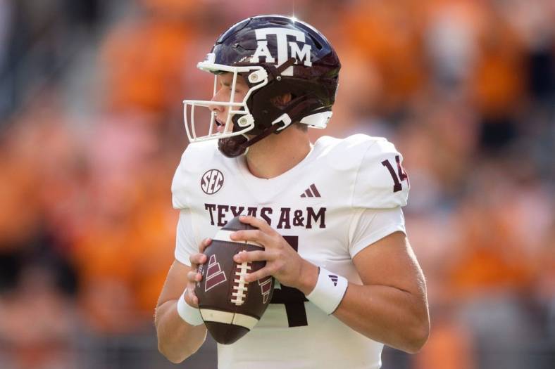 Texas A&M quarterback Max Johnson (14) looks to pass during a football game between Tennessee and Texas A&M at Neyland Stadium in Knoxville, Tenn., on Saturday, Oct. 14, 2023.