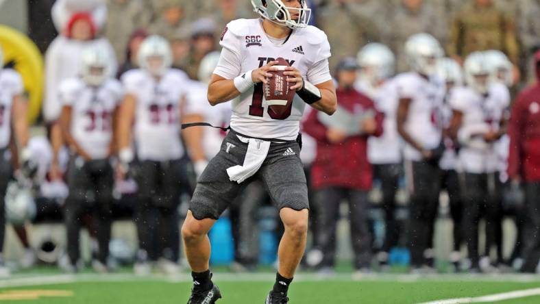 Oct 14, 2023; West Point, New York, USA; Troy Trojans quarterback Gunnar Watson (18) looks to pass against the Army Black Knights during the first half at Michie Stadium. Mandatory Credit: Danny Wild-USA TODAY Sports