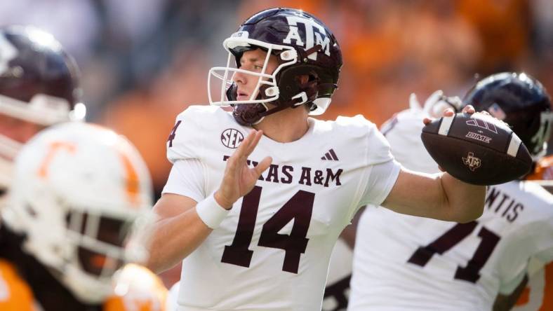 Texas A&M quarterback Max Johnson (14) throws a pass during a football game between Tennessee and Texas A&M at Neyland Stadium in Knoxville, Tenn., on Saturday, Oct. 14, 2023.