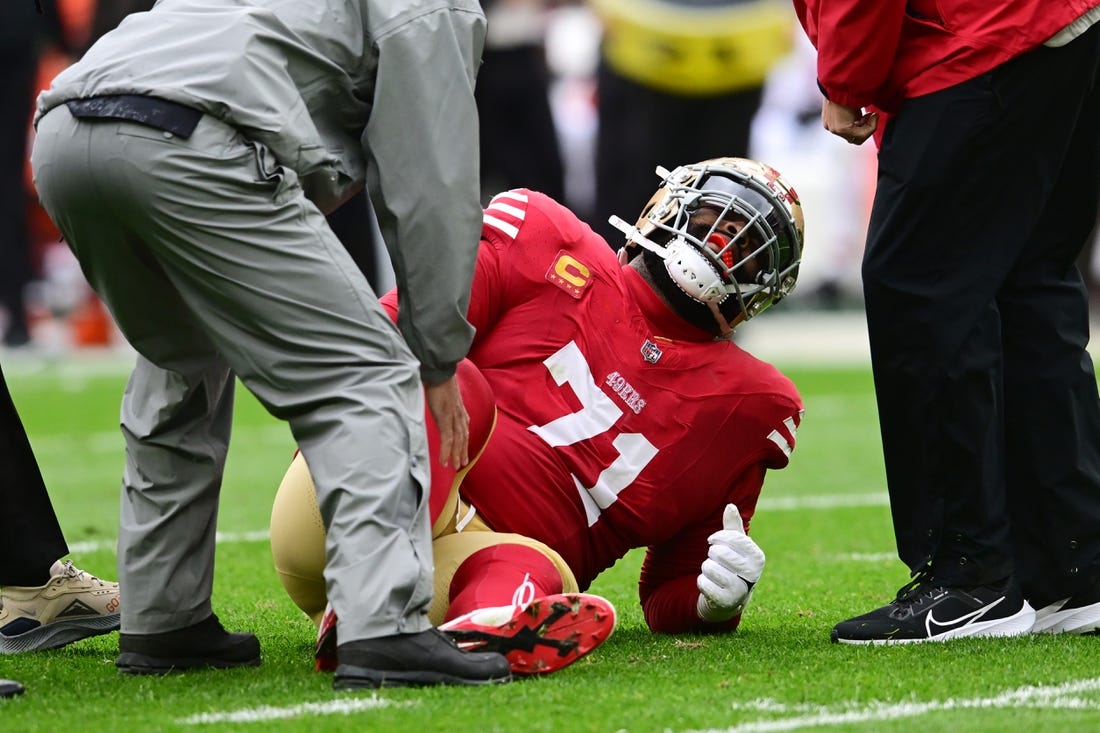 Oct 15, 2023; Cleveland, Ohio, USA; San Francisco 49ers offensive tackle Trent Williams (71) is looked at by trainers during the first half against the Cleveland Browns at Cleveland Browns Stadium. Mandatory Credit: Ken Blaze-USA TODAY Sports