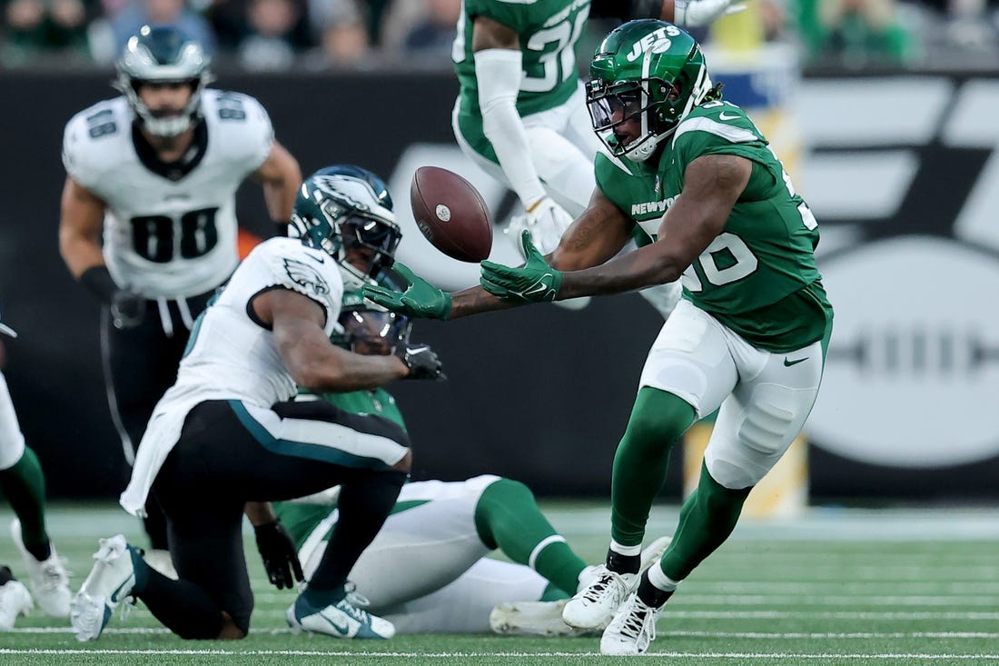 Oct 15, 2023; East Rutherford, New Jersey, USA; New York Jets linebacker Quincy Williams (56) attempts to recover a fumble by Philadelphia Eagles running back D'Andre Swift (0) during the second quarter at MetLife Stadium. Mandatory Credit: Brad Penner-USA TODAY Sports