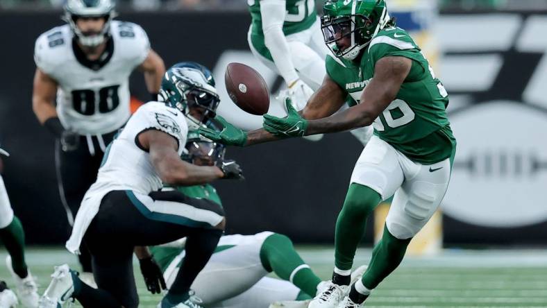 Oct 15, 2023; East Rutherford, New Jersey, USA; New York Jets linebacker Quincy Williams (56) attempts to recover a fumble by Philadelphia Eagles running back D'Andre Swift (0) during the second quarter at MetLife Stadium. Mandatory Credit: Brad Penner-USA TODAY Sports