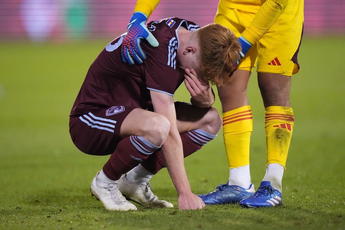 Oct 15, 2023; Denver, CO, USA; Colorado Rapids goalkeeper Abe Rodriguez (26) consoles midfielder Oliver Larraz (18) following the loss to the Austin FC II following a shoot out in the Western Conference Final at Dick's Sporting Goods Park. Mandatory Credit: Ron Chenoy-USA TODAY Sports