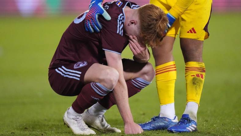 Oct 15, 2023; Denver, CO, USA; Colorado Rapids goalkeeper Abe Rodriguez (26) consoles midfielder Oliver Larraz (18) following the loss to the Austin FC II following a shoot out in the Western Conference Final at Dick's Sporting Goods Park. Mandatory Credit: Ron Chenoy-USA TODAY Sports