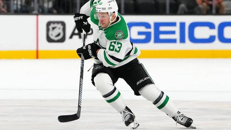 Oct 17, 2023; Las Vegas, Nevada, USA; Dallas Stars right wing Evgenii Dadonov (63) skates against the Vegas Golden Knights during an overtime period at T-Mobile Arena. Mandatory Credit: Stephen R. Sylvanie-USA TODAY Sports