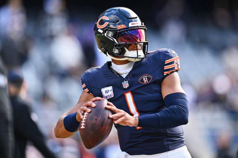 Oct 15, 2023; Chicago, Illinois, USA;  Chicago Bears quarterback Justin Fields (1) warms up before a game against the Minnesota Vikings at Soldier Field. Mandatory Credit: Jamie Sabau-USA TODAY Sports